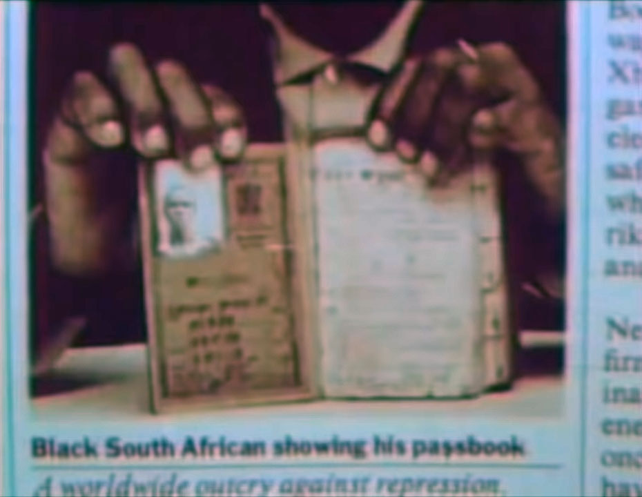 Black South African showing his passbook