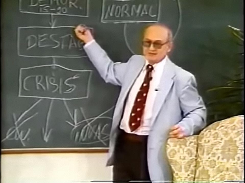 Bezmenov pointing at the chalkboard